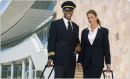 Aircrew with their secure baggage posing for a photo before boarding their aircraft.